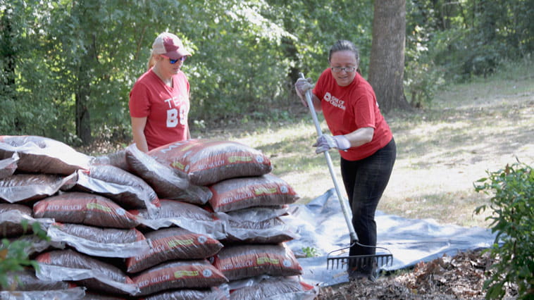 Bank of Oklahoma employees participate in hands-on volunteer activities.