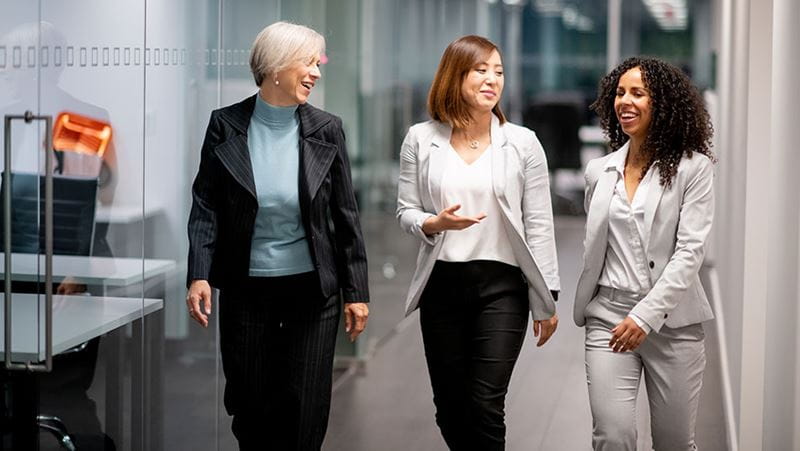 Female co-workers discussing retirement plans.