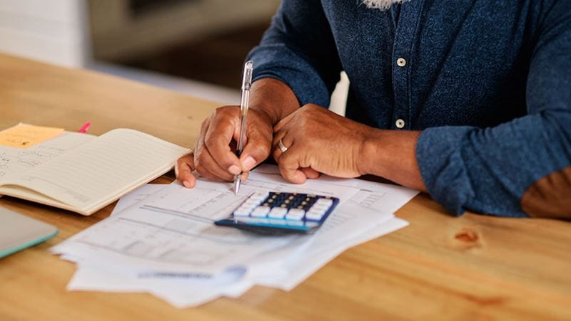 Man reviewing financial paperwork